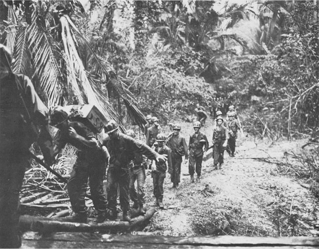 Men of the 1st Battalion, US 19th Infantry, carrying supplies near Hollandia, New Guinea, April 1944 (US Center of Military History)