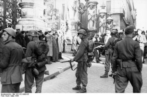 German troops and Italian collaborators round up civilians in front of the Palazzo Barberini, Rome, 23 March 1944, before the Ardeatine Caves Massacre (German Federal Archive: Bild 101I-312-0983-05)