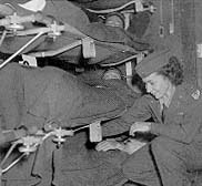 Flight nurse based in Prestwick, Scotland, preparing patients for transatlantic flight, 1944 (USAF photo)