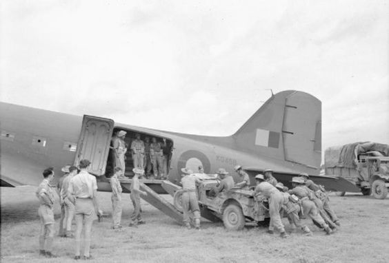Troops of 5th Indian Division loading a jeep into a Douglas Dakota of No.194 Squadron RAF during the reinforcement of the Imphal Garrison in India, March 1944. (Imperial War Museum)