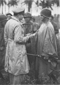 Gen. Douglas MacArthur decorates the Lt. Marvin J. Henshaw, with the Distinguished Service Cross, for his actions on Los Negros, 29 February 1944 (US Army Center of Military History)