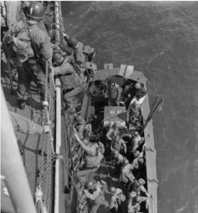 Exercise Fabius, Slapton Sands, England, May 1944. US infantry descend into an LCVP during D-day invasion practice. (US Army Center of Military History)