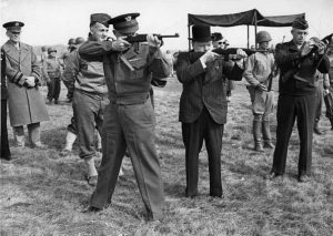 Maj. Gen. Edward Brooks (behind Eisenhower) demonstrating M1 Carbines to Gen. Dwight Eisenhower, Prime Minister Winston Churchill, and Gen. Omar Bradley, England, 15 May 1944 (US National Archives)