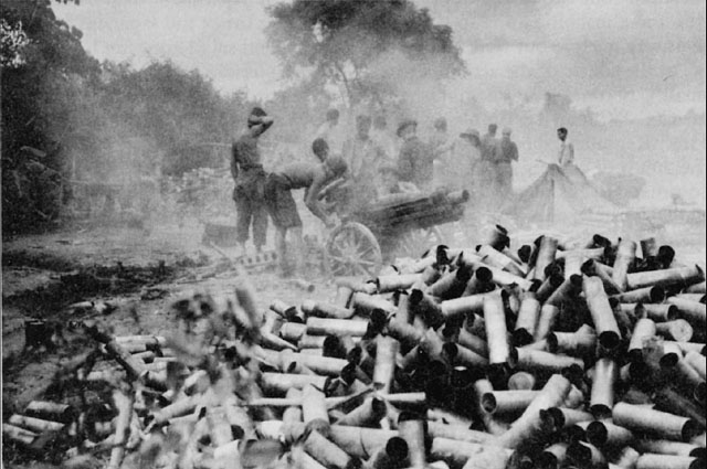 US 75-mm howitzer crew firing at Japanese positions in Myitkyina, Burma, June 1944 (US Army Center of Military History)