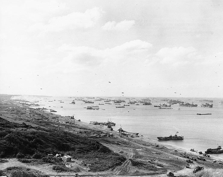 View looking west on Omaha Beach, Normandy, during resupply operations, 1 July 1944 (US National Archives: SC 206826)