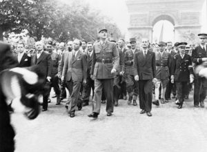Gen. Charles de Gaulle and his entourage at the Arc de Triomphe, Paris, 26 Aug 1944 (Imperial War Museum: HU 66477)