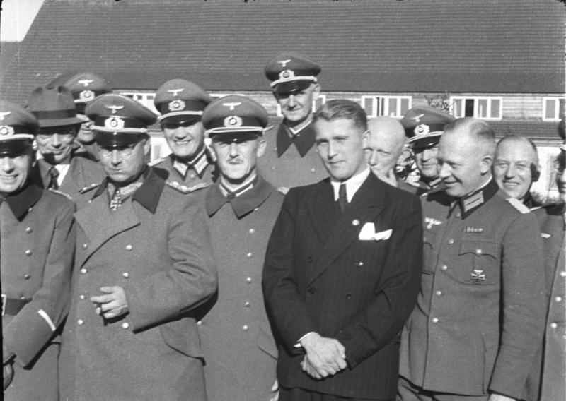 Wernher von Braun (in civilian clothes) with German officers at Peenemünde, Germany, 21 March 1941 (German Federal Archives: Bild 146-1978-Anh.024-03)