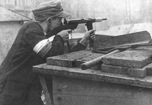 Polish resistance fighter during the Warsaw Uprising, Aug 1944 (public domain via WW2 Database)