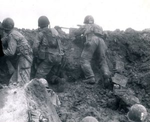 One of the very few pictures showing the US 2nd Ranger Battalion in action on D-day inside a crater on Pointe du Hoc (US Navy photo)