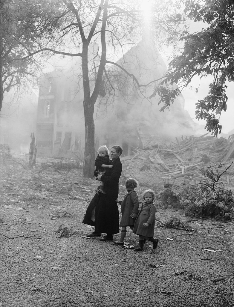 A family of refugees in devastated Enghien, Belgium, after the German invasion, May 1940 (Imperial War Museum: F 4499)
