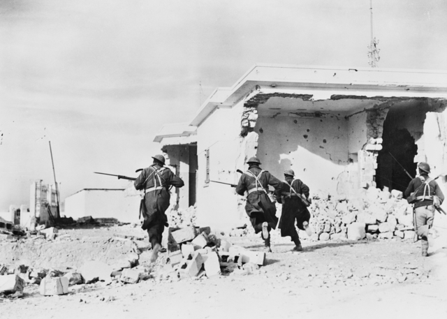 Australian troops rushing through the streets of Bardia, Libya, 4 Jan 1941 (Australian War Memorial: 006083)