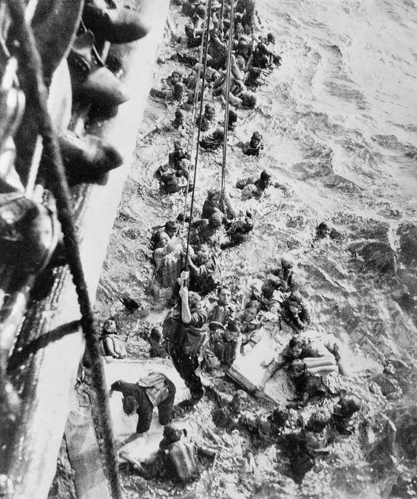 Survivors of battleship Bismarck being pulled aboard HMS Dorsetshire, 27 May 1941 (Imperial War Museum: 4700-26 ZZZ 3130C)
